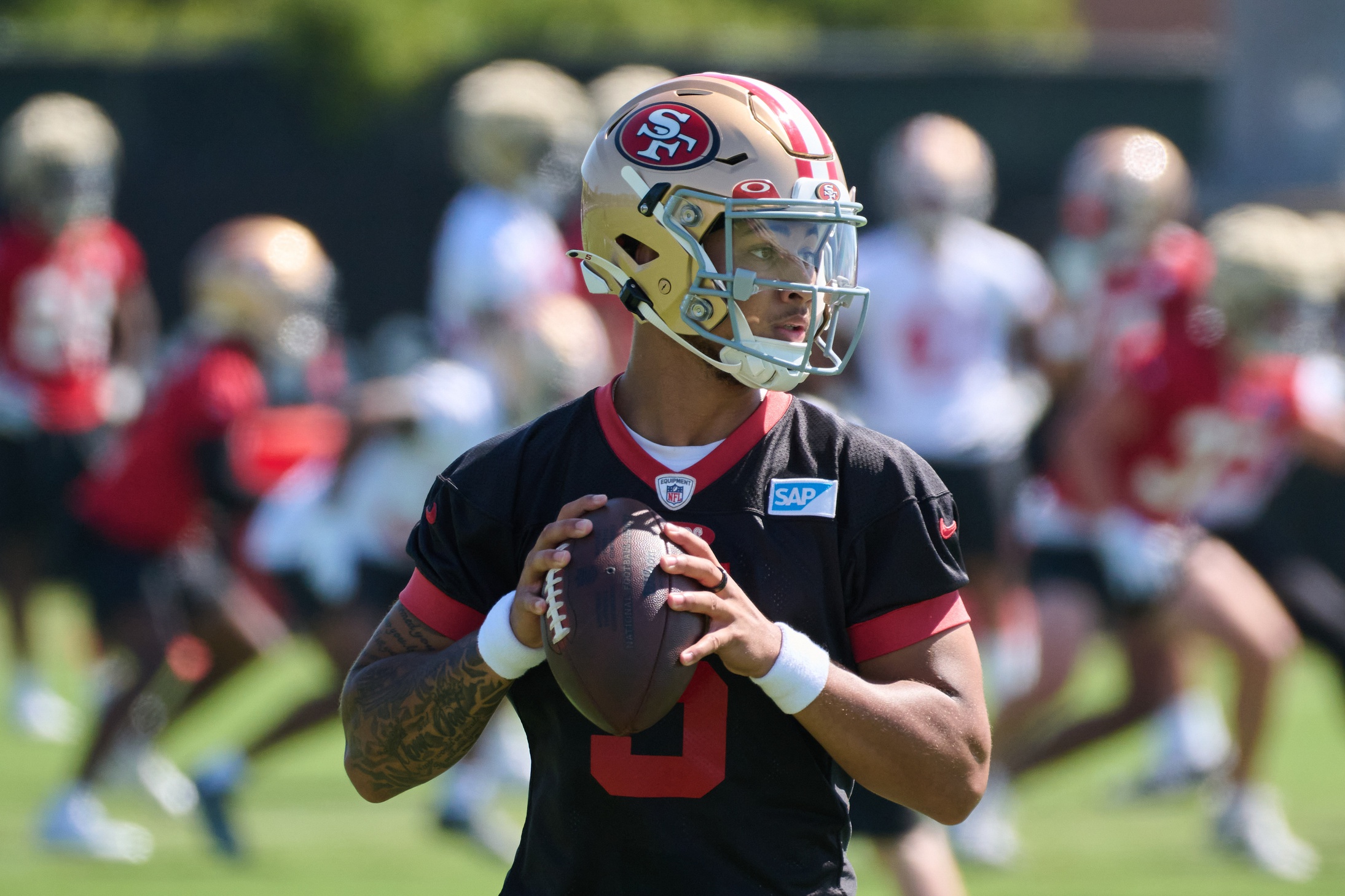 San Francisco 49ers quarterback Trey Lance (5) scrambles from Las